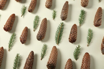 Christmas background with festive decoration and toys.On white wood surface. Holidays greeting card or banner composition with pine tree branches. Merry Christmas background and Happy New Year 2023.