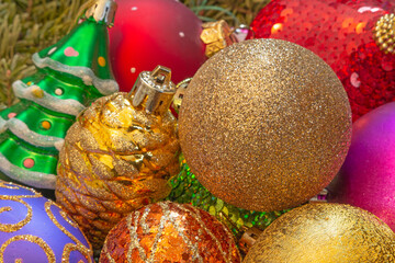 heap of bright Christmas tree ornaments