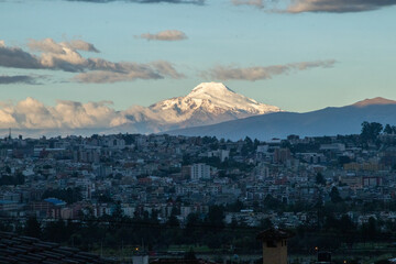 View of the beautiful Cayambe Volcano from the city of Quito on a summer day.
