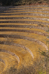 Pelfil of the circular terraces inside the Moray Ruins during sunset, Sacred Valley, Peru.
