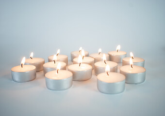Burning candles on a white background 