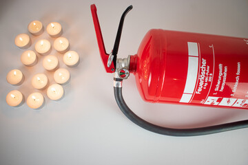 Fire extinguisher and burning candles