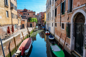 Fototapeta na wymiar Characteristic views of the city of Venice. Boats, gondolas and canal.