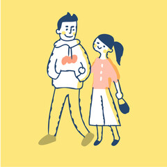 腕を組んで歩く若いカップル