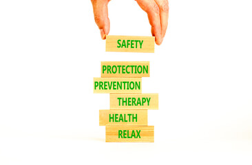 Health and safety symbol. Concept words Safety Protection Prevention Therapy Health Relax on wooden...