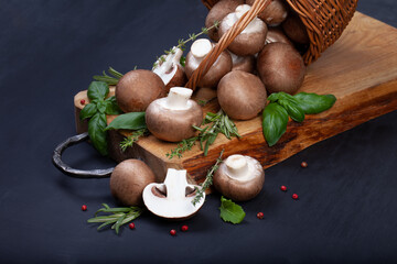 Fresh champignon mushrooms on dark wooden table - 546348319