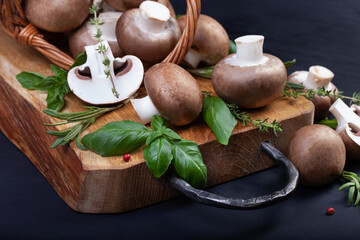 Fresh champignon mushrooms on dark wooden table - 546348351