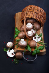 Fresh champignon mushrooms on dark wooden table - 546348356