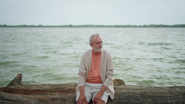 Portrait of senior man on beach.