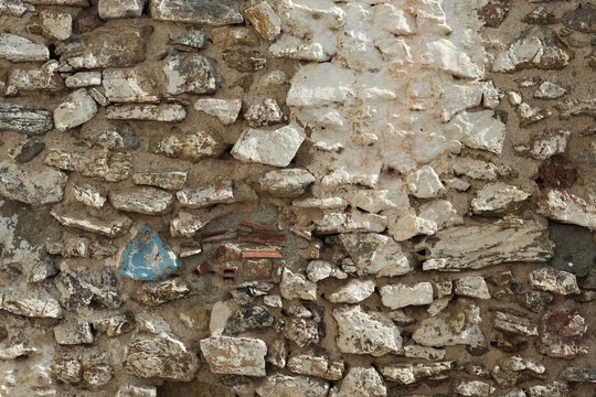 Stony textured wall outdoors, closeup view