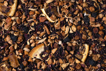 Exotic fruit tea with whole fruit pieces as a background.