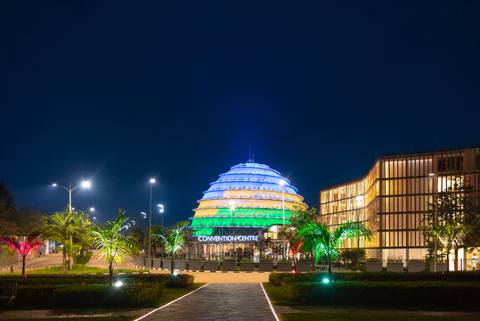 Kigali, Rwanda - August 19 2022: Kigali Convention Centre lit up in the colors of the Rwandan flag. The facility, designed after the inside of a king's palace, is able to host a variety of events