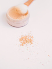 the powder is scattered on the table. Delicate photography in a beige hue.  Facial