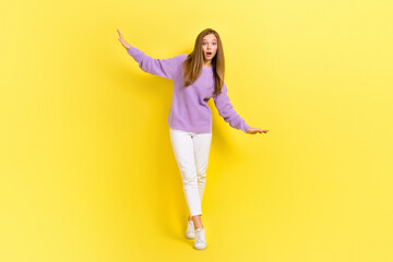 Fototapeta na wymiar Full length photo of terrified risky lady wear violet trendy going tightrope impressed height isolated on yellow color background