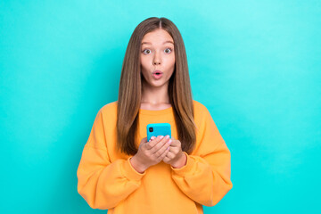 Photo of young excited funny teen girl pouted lips hold phone unexpected how popular her new tiktok...