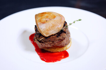 Tournedos Rossini. Foie gras, Black Angus beef tenderloin, with red wine sauce. Fillet mignon steak with Foie Gras.
