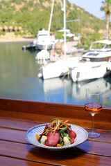 Seasonal Salad with Homemade Pastrami or bacon. With blush or rose wine.