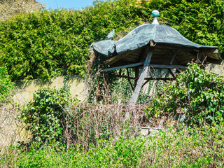 Weathered and overgrown pavilion