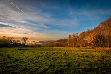 Landscape in Ceske Stredohori in color autumn sunny evening with inversion