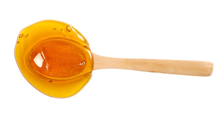 Honey puddle with wooden spoon isolated on white, top view