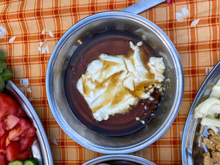 Honey and cream prepared for breakfast