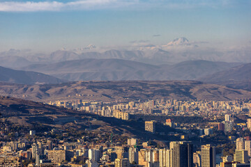 top view of the city of Tbilisi in Georgia and Mount Kazbek on the horizon