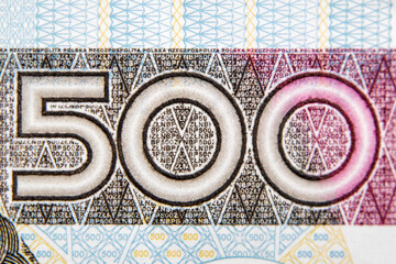 Macro photo shot of Polish PLN number 500 banknote, shallow depth of field.