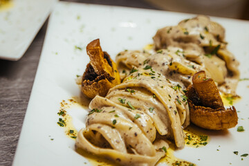 Fettuccine with sauce served on a plate