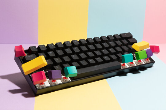 Colourful computer keyboard with multiple flying color keys 