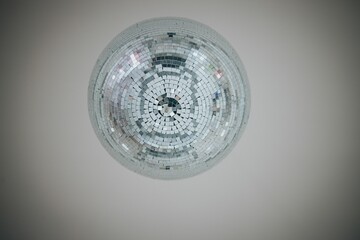 Low-angle shot of a disco ball at a wedding ceremony