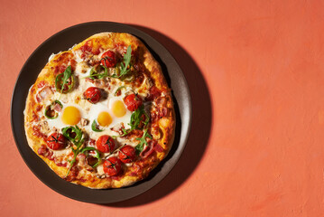 breakfast pizza with eggs, top view, place for text