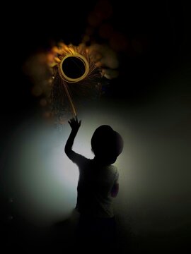 silhouette of a child ligth painting.