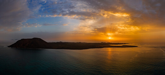 Dramatic aerial panoramic view of the sunrise over the island of Lobos near Corralejo Fuerteventura