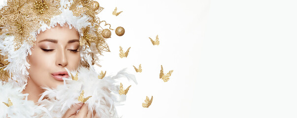 Gorgeous model girl with golden festive makeup and hairstyle. High fashion portrait of a fairy...
