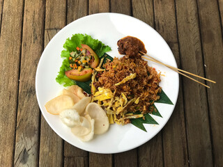 Fried rice, shredded omelet and satay is traditional food in Indonesia