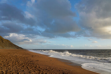 Fototapeta na wymiar Clouds over the beach, Hive Beach, Dorset 