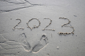 2023 inscription on beach sand. Writting on the beach sand. New year 2023. 