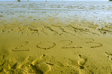 2023 inscription on beach sand. Writting on the beach sand. New year 2023. 