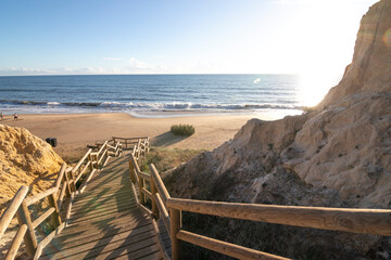 One of the most beautiful beaches in Spain, called (Cuesta Maneli, Huelva) in Spain.  Surrounded by dunes, vegetation and cliffs.  A gorgeous beach.