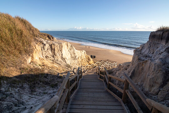 One of the most beautiful beaches in Spain, called (Cuesta Maneli, Huelva) in Spain.  Surrounded by dunes, vegetation and cliffs.  A gorgeous beach.