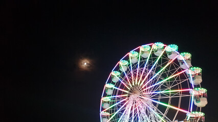 ferris wheel on the background of the night sky