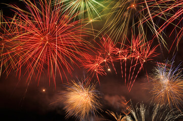 Sky full of firework explosions, party and celebration