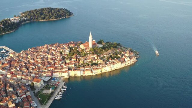 Aerial of the beautiful Rovinj cityscape with red roof buildings and the blue sea in Croatia