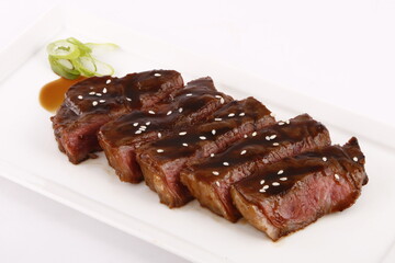 Yakiniku wagyu - Japanese food of grilled wagyu beef with yakiniku sauce and sesame seeds