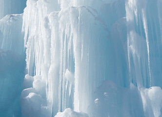 White ice structure. Abstract dramatic icicle wall background. Cold snow banner.