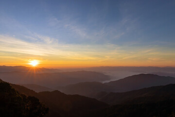 Beautiful sunrise over the mountain range at the east of Thailand.