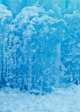 Wintery texture. Blue ice wall pattern background. Vertical with copyspace. 