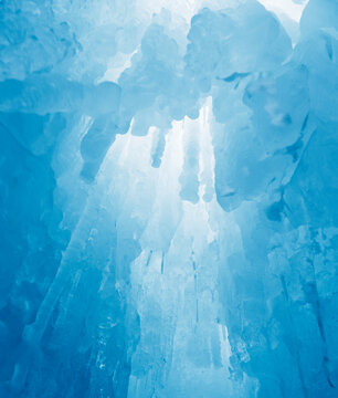 Blue Icy abstract photograph. Cyan icicle pattern vertical background.