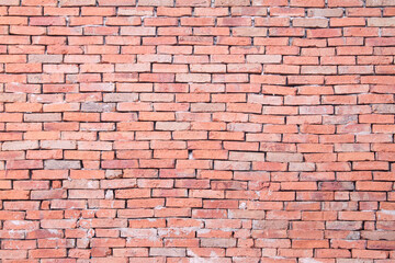 red brick wall texture grunge background with vignetted corners, may use to interior design may use to interior design