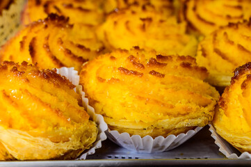 Baked sweet desserts cakes on display in balery in Lisbon, Portugal